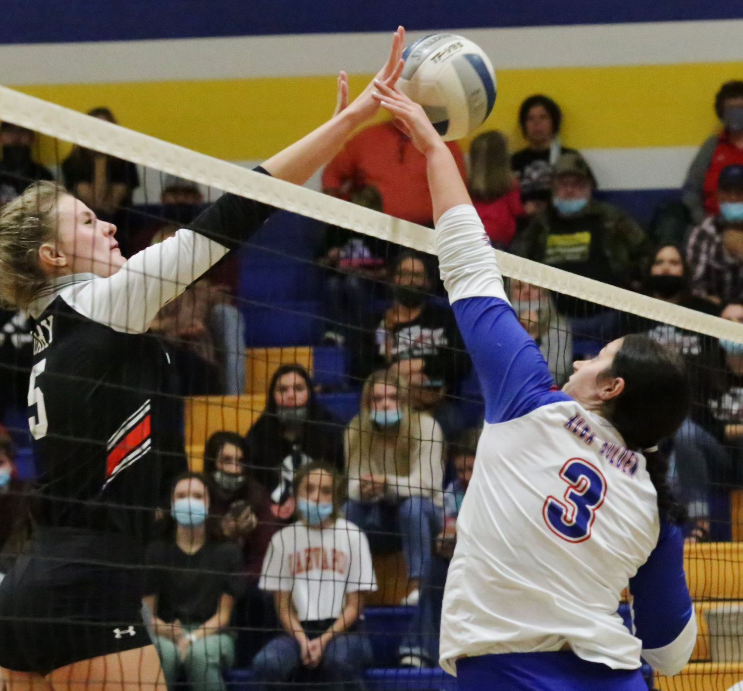 Lady Panther Kalli Wright challenges at the net.
